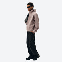 
                  
                    Seamless construction rain jacket - mauve and black color variants side and back views, for travel and everyday wear
                  
                