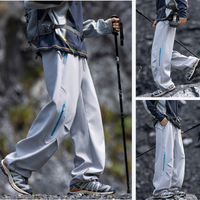 
                  
                    Breathable warm trail pants with soft fleece lining - light gray fleece-lined hiking pants with dark jacket
                  
                