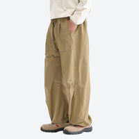 
                  
                    Unisex quick-dry water-repellent hiking pants - khaki tan wide-leg hiking pants with cream top
                  
                