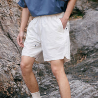 
                  
                    Water-repellent nylon shorts for outdoor - cream white quick-dry shorts with navy tee, for cycling and outdoor weekends
                  
                