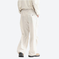 
                  
                    Unisex quick-dry water-repellent hiking pants - cream white wide-leg hiking pants with cream top, back walking view
                  
                