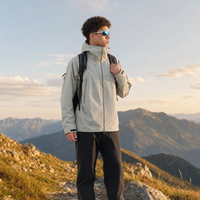 
                  
                    Men's technical hardshell with hood - light gray color variant views, on-model front view, for travel and everyday wear
                  
                