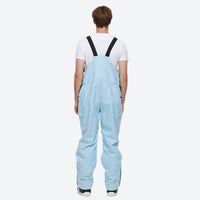 
                  
                    Unisex waterproof 2L snow jacket and bib pants - ice blue bib pants, on-model front view, for powder and piste riding
                  
                
