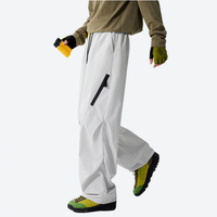 
                  
                    Breathable 650+ fill power duck down snow pants - white down pants, side walking view, for winter commute and travel
                  
                