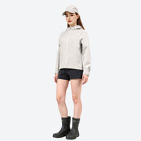 
                  
                    Waterproof fitted hiking jacket for women - light gray off-white jacket front and lifestyle views, for everyday outdoor wear
                  
                