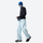 Unisex waterproof 2-in-1 down pants with liner - ice blue down pants with black top and blue beanie, walking view