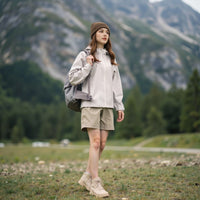 
                  
                    Waterproof fitted hiking jacket for women - light blue jacket front and lifestyle views, for mountain trekking and climbing
                  
                