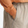 Unisex lightweight outdoor cargo pants - tan, waist pocket close-up with hand, for camping and travel