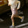 Lightweight water-repellent running shorts with liner - pink water-repellent shorts with white top, running view on street