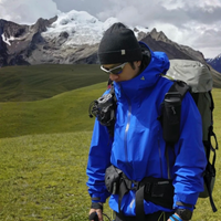 
                  
                    Men's technical hardshell with hood - blue color variant front views, for travel and everyday wear
                  
                