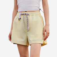 
                  
                    PFC-free eco trail shorts with quick-dry shell - yellow water-repellent shorts with white top, for running and trail running
                  
                