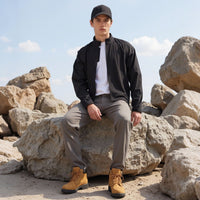
                  
                    Men's waterproof golf jacket - black men's golf jacket views, on-model back view, for golf and country club wear
                  
                