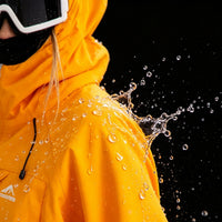 
                  
                    Men's 3-layer snowboard jacket and pants - black bib pants, on-model front view, for cold-weather winter sports
                  
                