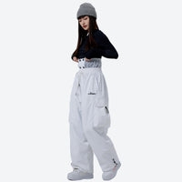 
                  
                    2L snowboard jacket and pants set - brown pants colorway, on-model three-quarter front view, for winter mountain adventures
                  
                
