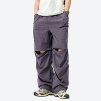 
                  
                    UPF 50+ sun protection zip-off pants - purple and teal pants lifestyle and product shots, for travel and backpacking
                  
                