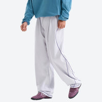 
                  
                    Women's knit cargo hiking pants with relaxed fit - navy knit cargo pants with white top, for hiking and trail walking
                  
                