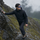 Men's technical hardshell with hood - black color variant front and side views, for hiking and mountain adventures