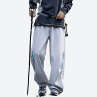 
                  
                    Unisex fleece-lined water-repellent hiking pants - light gray fleece-lined hiking pants with dark jacket
                  
                