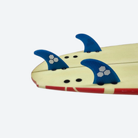 
                  
                    Honeycomb tri-fin setup for surfing - blue thruster fins on surfboard, for shortboard and funboard surfing
                  
                