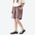 Unisex nylon quick-dry shorts - coffee brown quick-dry shorts with black tee, side walking view, for travel and city walks