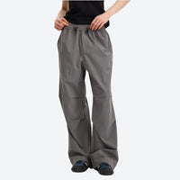 
                  
                    Unisex UPF50 water-repellent cargo pants - gray wide-leg cargo pants with black tee, for travel and daily commute
                  
                