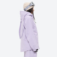 
                  
                    Women's waterproof 2L snow jacket and bib pants series - lavender jacket, on-model side view, for skiing and snowboarding
                  
                