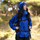 Lightweight hooded rain jacket for women - blue color variant front views, for hiking and mountain adventures