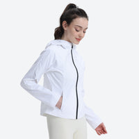 
                  
                    Luna women's 3L short hardshell jacket - white jacket views, on-model side view, for mountain and coastal adventures
                  
                