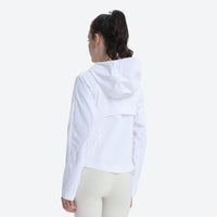 
                  
                    Women's waist-fit waterproof jacket with vents - white jacket views, on-model back view, for hiking and trail running
                  
                