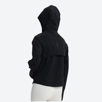 
                  
                    Women's waist-fit waterproof jacket with vents - black jacket views, on-model side view, for mountain and coastal adventures
                  
                