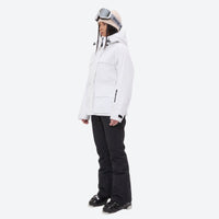 
                  
                    Women's 3-layer breathable ski suit - white jacket with black pants, on-model side view, for skiing and snowboarding
                  
                