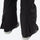 Women's 3-layer breathable ski suit - black bib pants, hem zip vent close-up detail, for snowy mountain travel