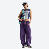 
                  
                    Breathable loose-fit trail pants with mesh lining - purple hiking pants with blue top, for travel and camping
                  
                
