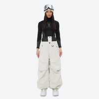 
                  
                    Women's waterproof 3L snow pants and jacket series - white snow pants with black top, for powder days and winter commute
                  
                