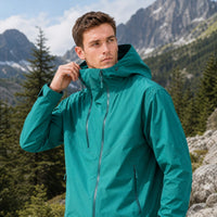 
                  
                    Breathable hardshell with adjustable hood - teal color variant front views, for travel and everyday wear
                  
                