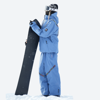 
                  
                    Colorblock snowboard jacket and pants set - cream, on-model front with snowboard and backpack, for powder and piste riding
                  
                