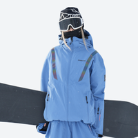 
                  
                    Breathable ski jacket and snow pants combo - blue, on-model front with upright snowboard, for skiing and snowboarding
                  
                