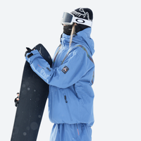 
                  
                    Waterproof snow jacket and pants set - blue, on-model front holding snowboard, for powder and piste riding
                  
                