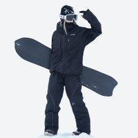 
                  
                    Waterproof snow jacket and pants set - black, on-model full-body front view, for cold-weather winter sports
                  
                