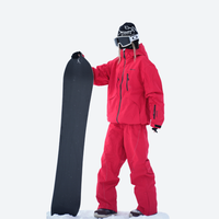 
                  
                    Waterproof snow jacket and pants set - cream, on-model front with snowboard and backpack, for cold-weather winter sports
                  
                