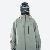 
                  
                    Waterproof snow jacket and pants set - cream, on-model front with upright snowboard, for skiing and snowboarding
                  
                