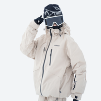 
                  
                    Colorblock snowboard jacket and pants set - women's cream, on-model front with goggles on head, for powder and piste riding
                  
                