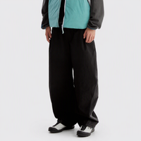 
                  
                    Black outdoor utility pants worn side view
                  
                