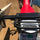 Universal surfboard rack for ebikes and scooters - rack mounted on motorcycle rear rack views, on-model back hood view