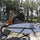 Universal surfboard rack for ebikes and scooters - rack mounted on scooter with surfboard lifestyle shots