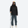 Women's 3L rain jacket for hiking - close-up details of zippers and technical features, on-model back hood view