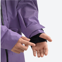 
                  
                    Women's waterproof 3L insulated snow jacket - purple, chest zip close-up with gloved hand, for powder and piste riding
                  
                