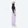 Women's 2-layer snowboard jacket and bibs - lavender bib pants with black top, on-model side view, for resort and street wear