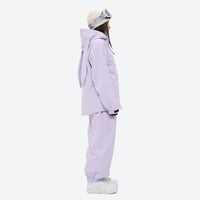 
                  
                    Women's quilted lining ski jacket with suspender bibs - lavender jacket with lavender bib pants, on-model side view
                  
                