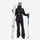 Women's belted snow jacket with suspender pants - black, front with upright skis and poles, for resort and cross-country days
